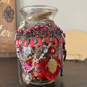Beautiful And Colorful Jewelry Collection In A Mystery Jar In Red And Purple.